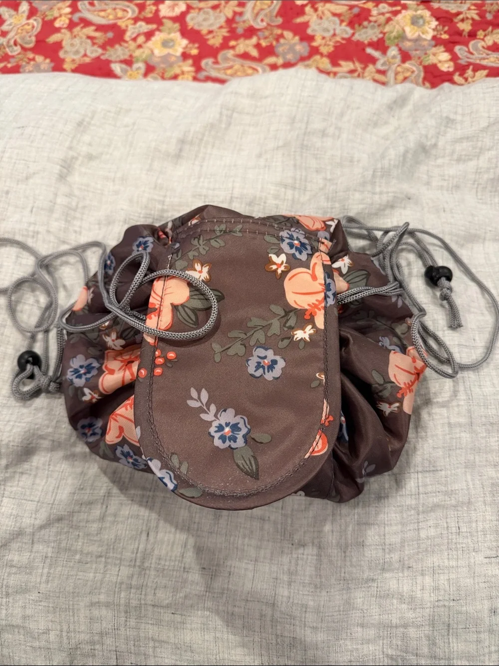 Lay flat Floral Drawstring Cosmetic Bag in Brown with Coral Accents
